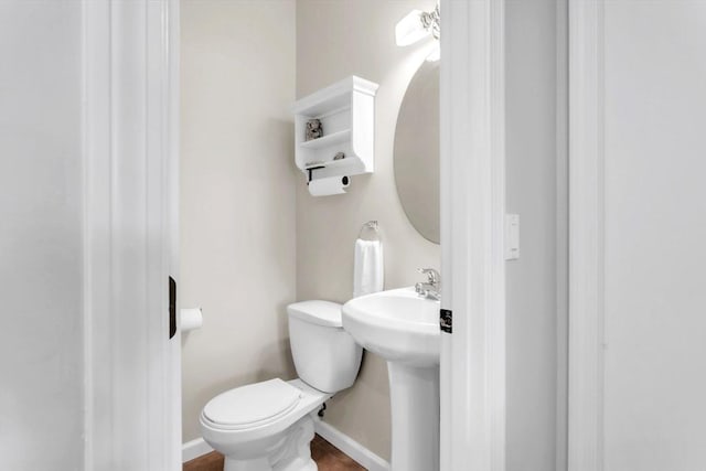 bathroom featuring sink and toilet