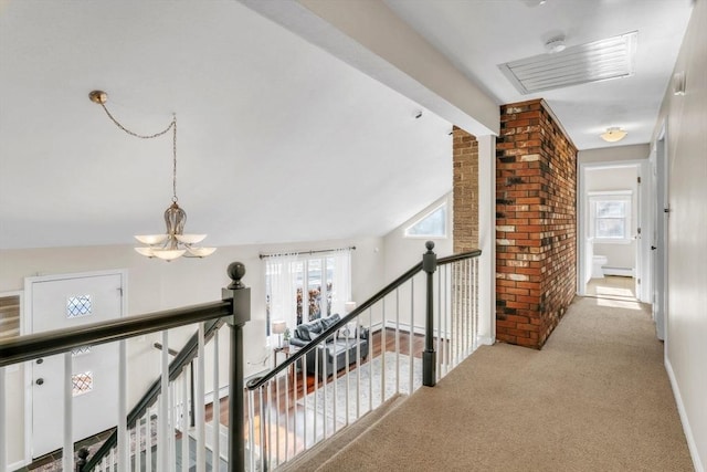 hall featuring light carpet, vaulted ceiling with beams, a chandelier, and baseboard heating