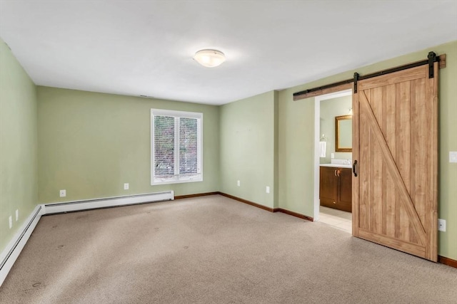 unfurnished bedroom with light carpet, a baseboard radiator, and a barn door