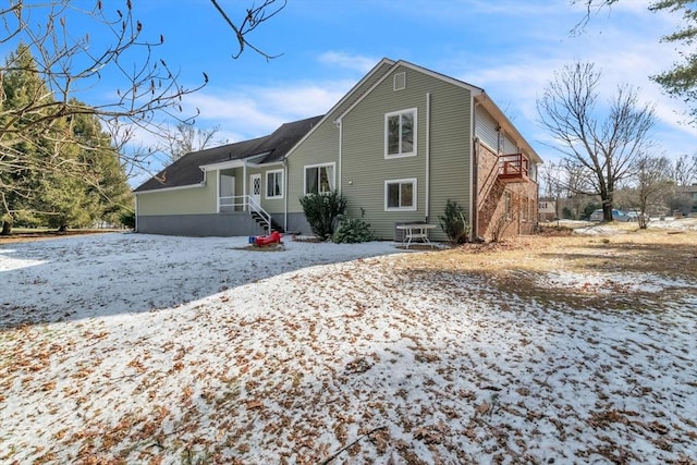 view of snow covered house