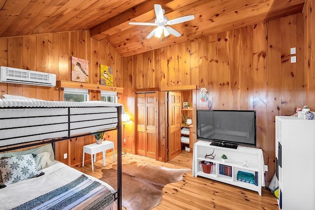 bedroom with a wall unit AC, wood-type flooring, wooden ceiling, vaulted ceiling with beams, and a closet