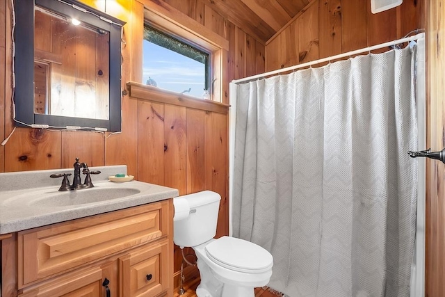 bathroom featuring vanity, wood walls, vaulted ceiling, toilet, and wood ceiling