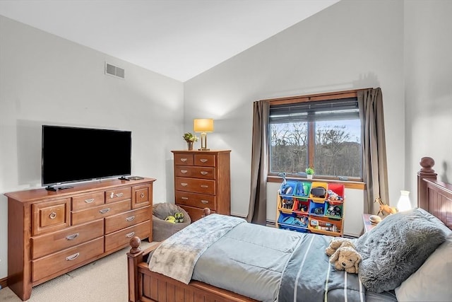 carpeted bedroom featuring lofted ceiling