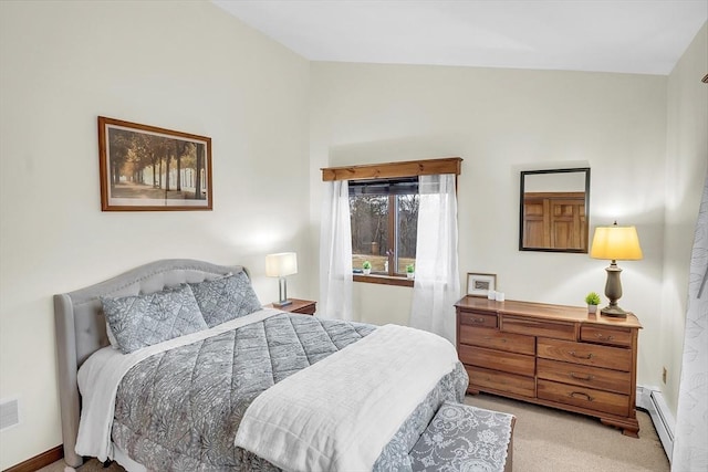 carpeted bedroom featuring a baseboard radiator and vaulted ceiling