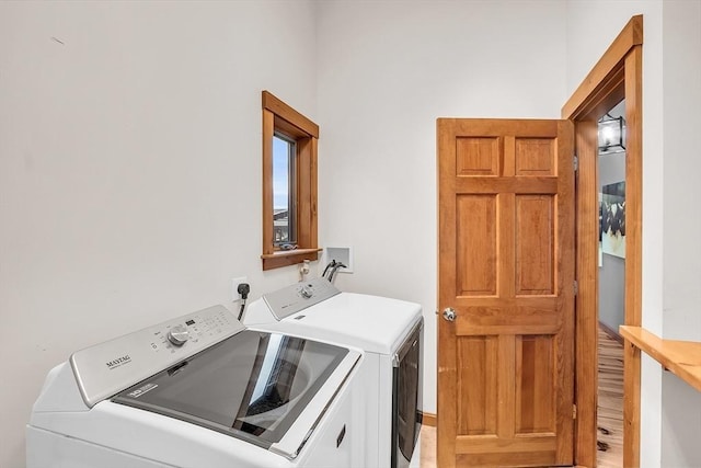 laundry room featuring washing machine and dryer