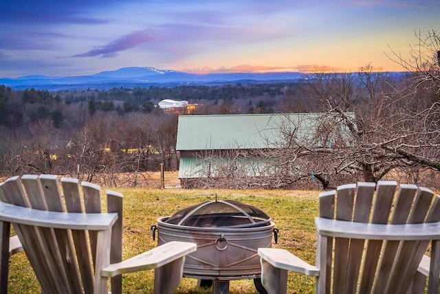 yard at dusk with a mountain view