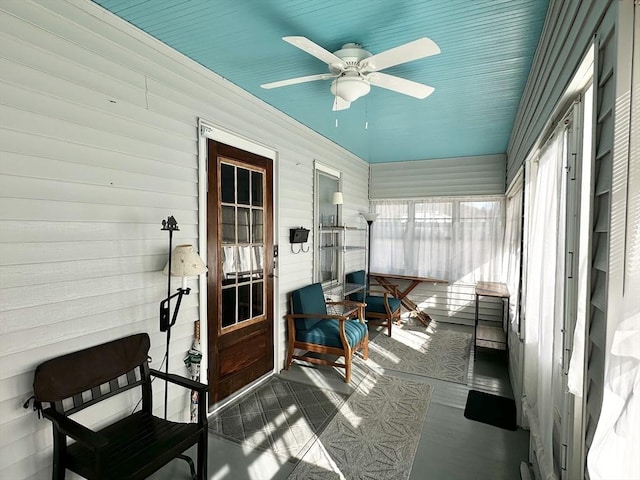 sunroom with a ceiling fan