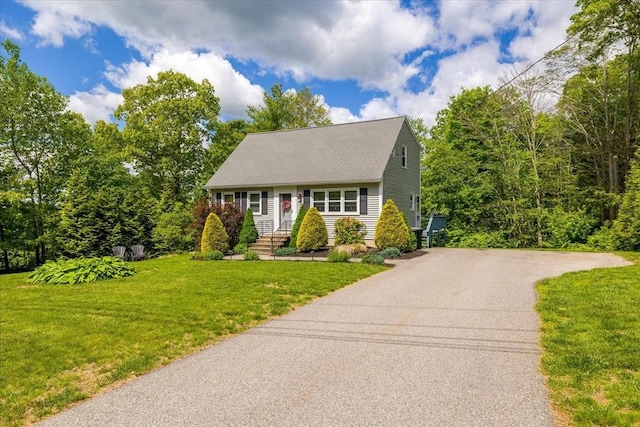 148 Prince Rd, Southbridge, MA 01550 - new england style home with asphalt driveway, a front lawn, and roof with shingles