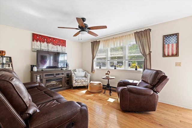 148 Prince Rd, Southbridge, MA 01550 - living area with a ceiling fan, hardwood / wood-style flooring, a baseboard radiator, and baseboards