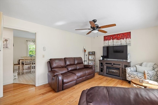 148 Prince Rd, Southbridge, MA 01550 - living area featuring a ceiling fan, light wood-style flooring, and baseboards