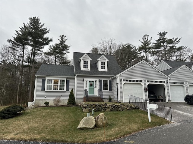 view of front of home featuring a garage and a front yard