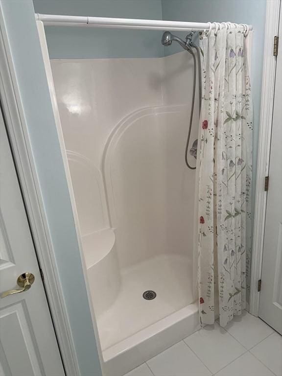 bathroom featuring a shower with curtain and tile patterned floors