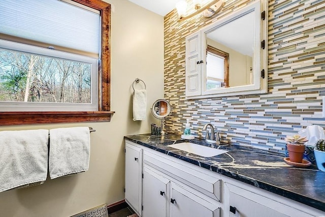 bathroom featuring backsplash and vanity