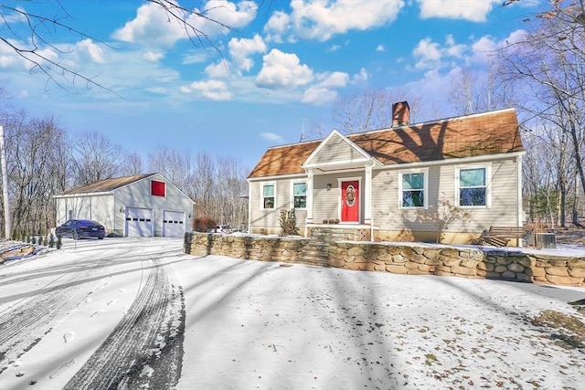 view of front of home featuring a garage and an outdoor structure