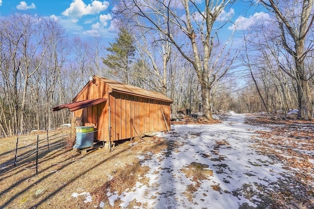 snow covered structure featuring cooling unit