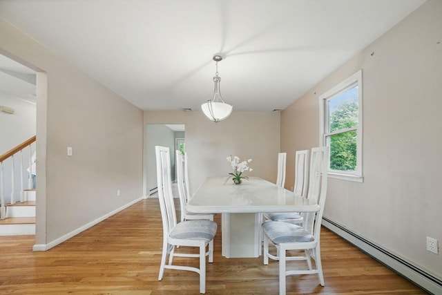 20 Tarleton Rd, Boston, MA 02132 - dining space with a baseboard radiator, light wood-type flooring, stairs, and baseboards