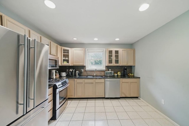 20 Tarleton Rd, Boston, MA 02132 - kitchen with stainless steel appliances, dark countertops, backsplash, glass insert cabinets, and recessed lighting