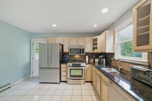 20 Tarleton Rd, Boston, MA 02132 - kitchen with appliances with stainless steel finishes, a sink, baseboard heating, light brown cabinetry, and tasteful backsplash