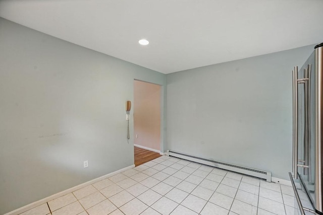 20 Tarleton Rd, Boston, MA 02132 - spare room with a baseboard heating unit, baseboards, light tile patterned floors, and recessed lighting