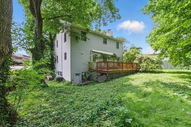 20 Tarleton Rd, Boston, MA 02132 - back of property featuring a chimney and a deck