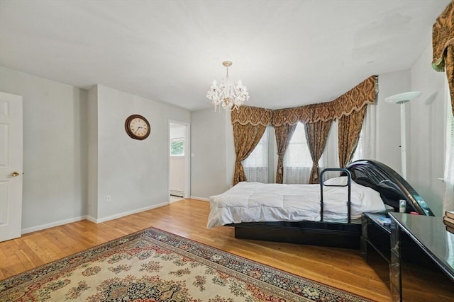 20 Tarleton Rd, Boston, MA 02132 - bedroom featuring wood finished floors, a chandelier, and baseboards