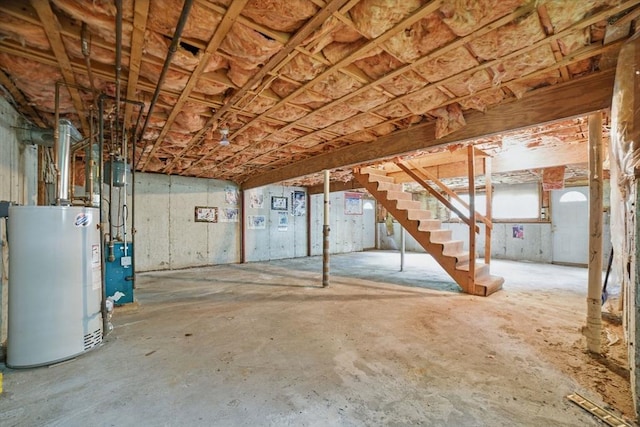 20 Tarleton Rd, Boston, MA 02132 - unfinished basement featuring water heater, stairway, and a heating unit
