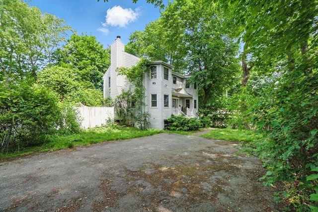 20 Tarleton Rd, Boston, MA 02132 - view of property exterior featuring a chimney