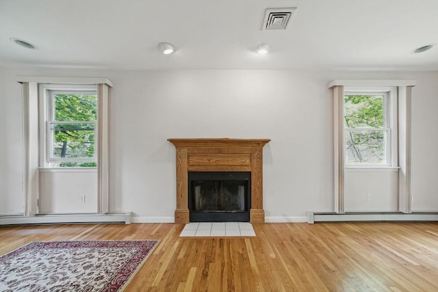 20 Tarleton Rd, Boston, MA 02132 - unfurnished living room featuring baseboard heating, healthy amount of natural light, and wood finished floors