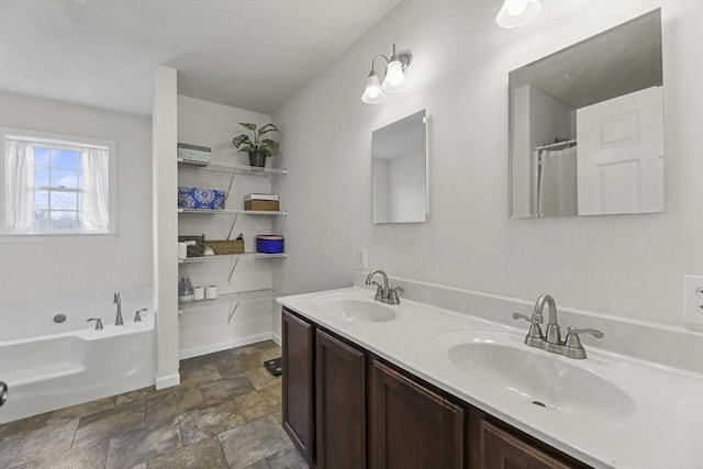 full bathroom with a garden tub, double vanity, and stone finish flooring