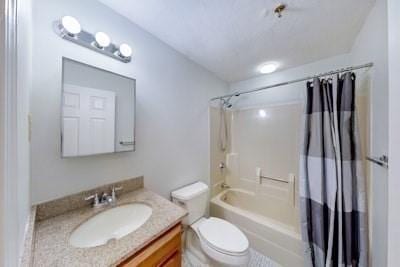 full bathroom with shower / tub combo, vanity, and toilet