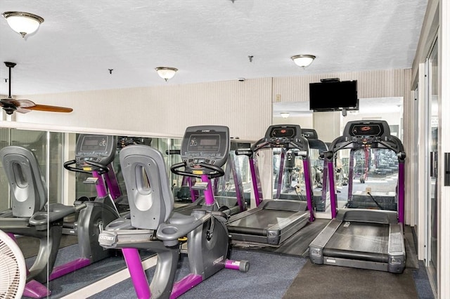 exercise room with a textured ceiling and ceiling fan