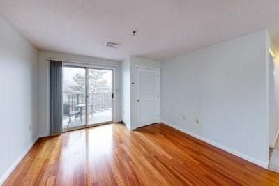 empty room with light wood-type flooring