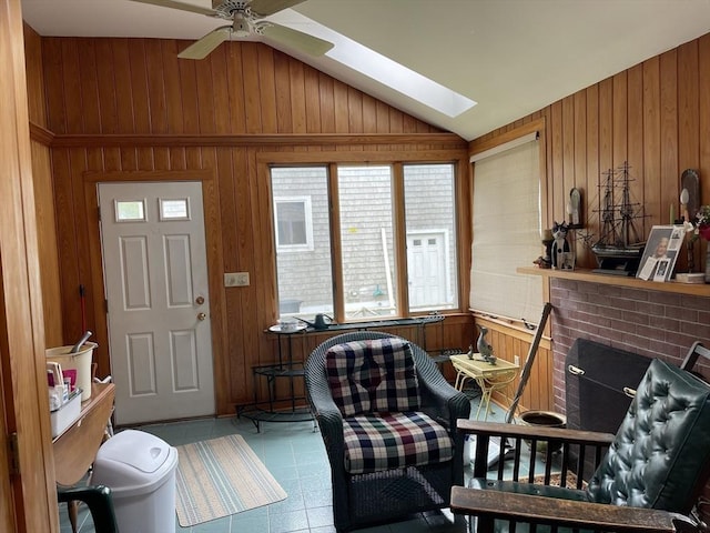 57 Harrington St, Falmouth, MA 02536 - foyer entrance featuring wood walls, vaulted ceiling, a skylight, and a ceiling fan