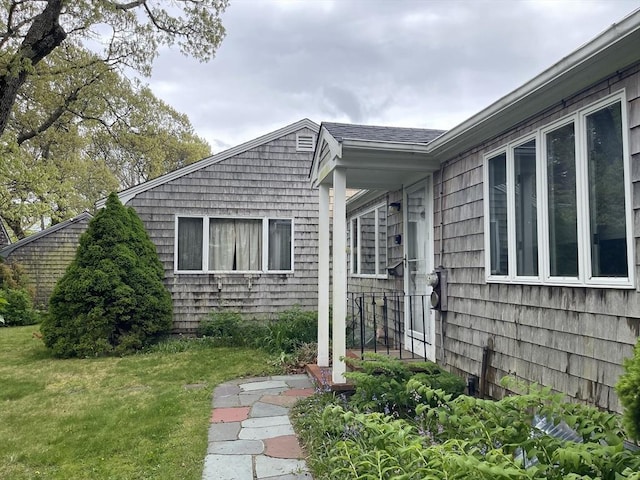 57 Harrington St, Falmouth, MA 02536 - view of exterior entry featuring a lawn