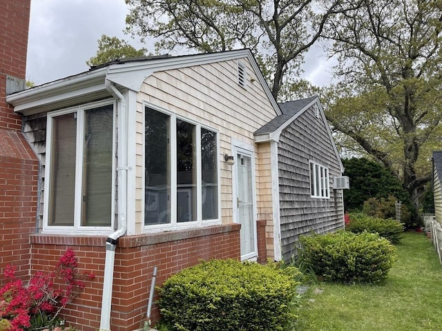 57 Harrington St, Falmouth, MA 02536 - view of side of home with brick siding