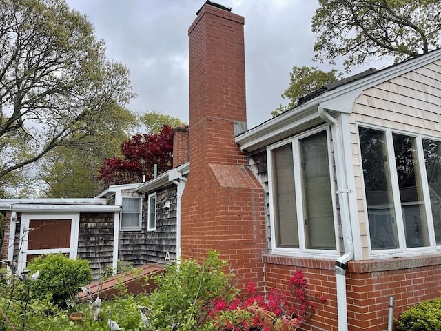 57 Harrington St, Falmouth, MA 02536 - view of side of property featuring a chimney