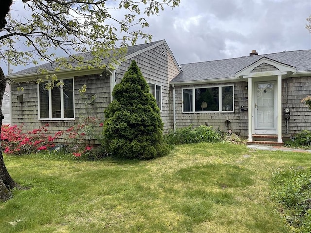 57 Harrington St, Falmouth, MA 02536 - view of front of property featuring roof with shingles and a front yard