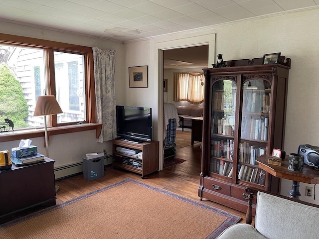 57 Harrington St, Falmouth, MA 02536 - sitting room featuring crown molding, wood finished floors, and a baseboard heating unit