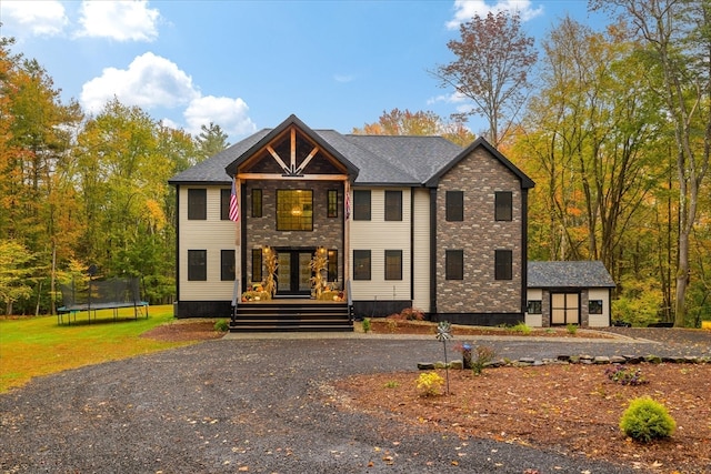 view of front of house with a trampoline