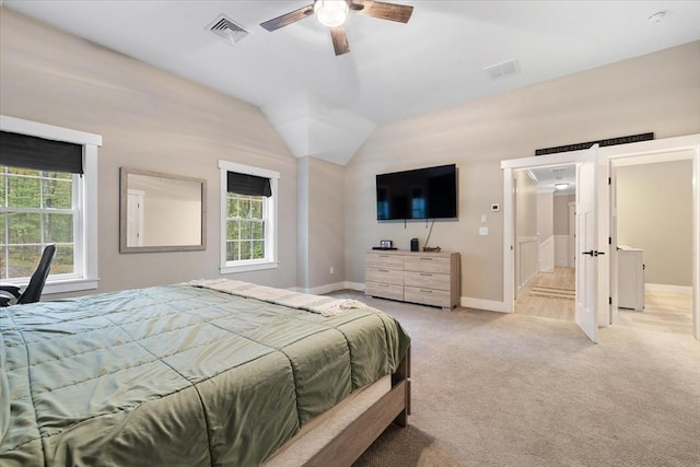 bedroom featuring visible vents, multiple windows, and light colored carpet