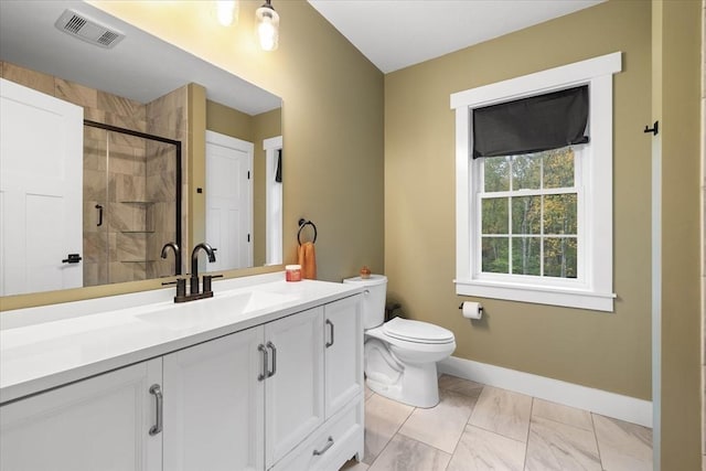 bathroom featuring a shower stall, vanity, visible vents, toilet, and baseboards