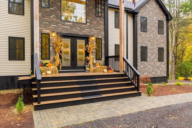doorway to property with french doors and stone siding