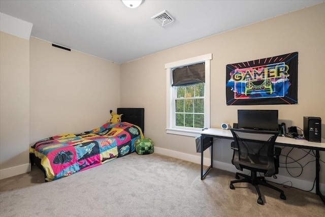 carpeted bedroom featuring visible vents and baseboards