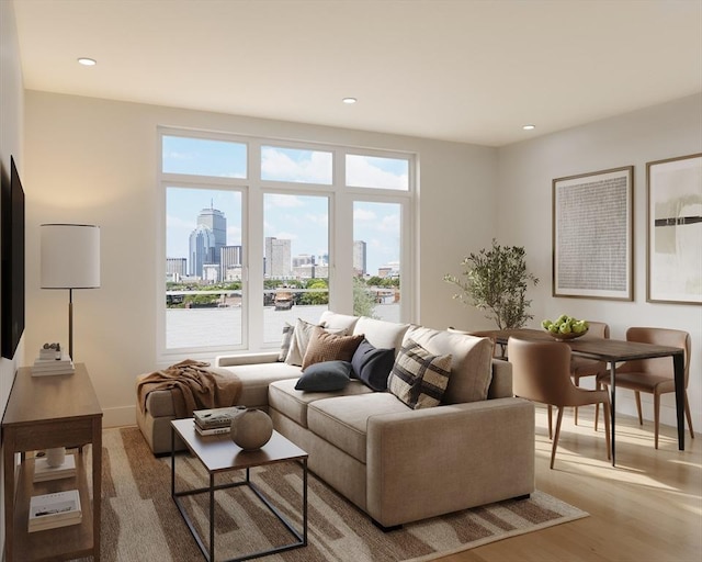 living area featuring a view of skyline, recessed lighting, and wood finished floors