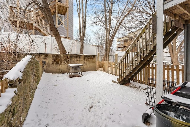 view of yard covered in snow