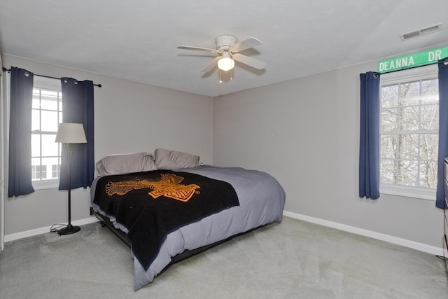 bedroom featuring ceiling fan and light colored carpet