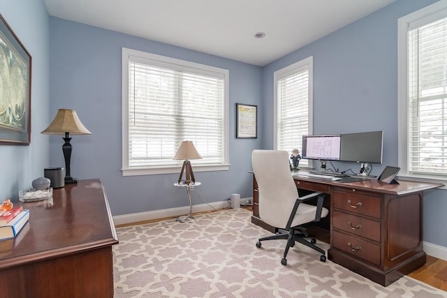 home office with light wood-type flooring