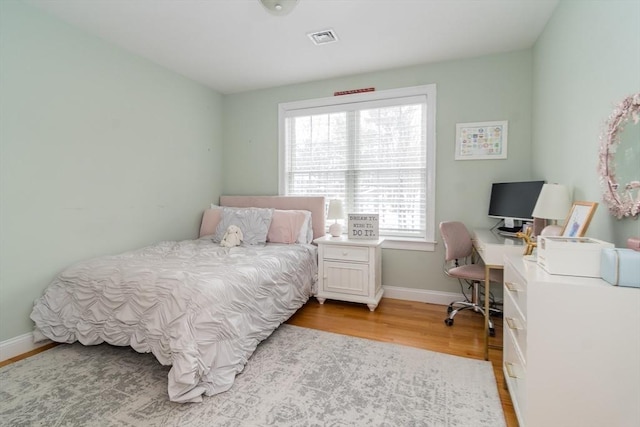 bedroom featuring light hardwood / wood-style floors