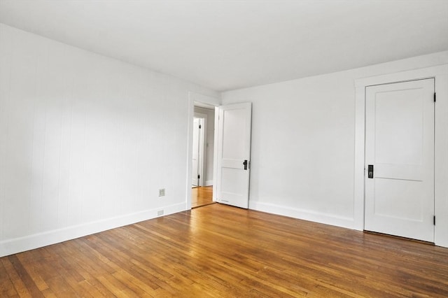 14 Lyman Ter, Waltham, MA 02452 - unfurnished room featuring hardwood / wood-style flooring and baseboards