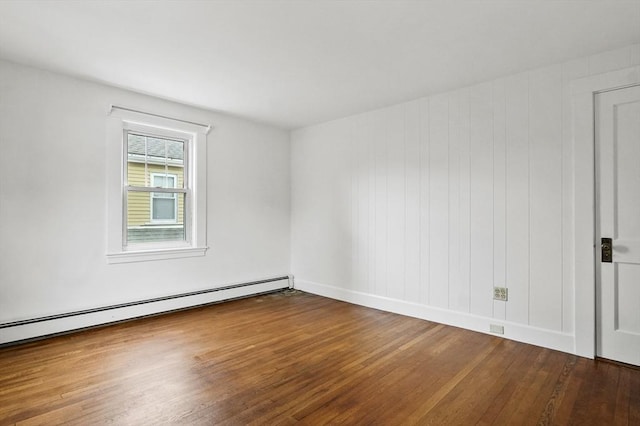 14 Lyman Ter, Waltham, MA 02452 - empty room featuring a baseboard radiator, wood finished floors, and baseboards